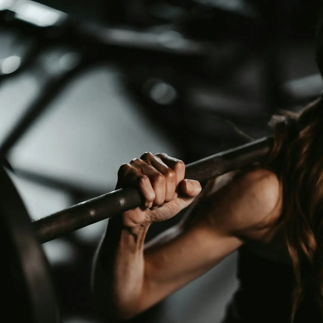 Close-up of hands gripping a barbell