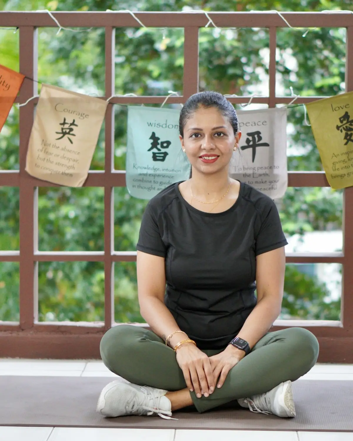 Woman meditating with eyes closed in a calm space