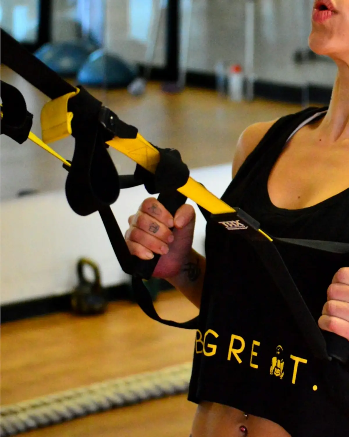Woman doing a TRX suspension strap row